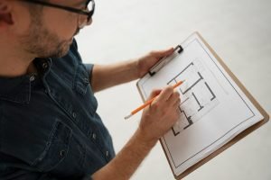 high-angle-man-making-design-plan_23-2149721865